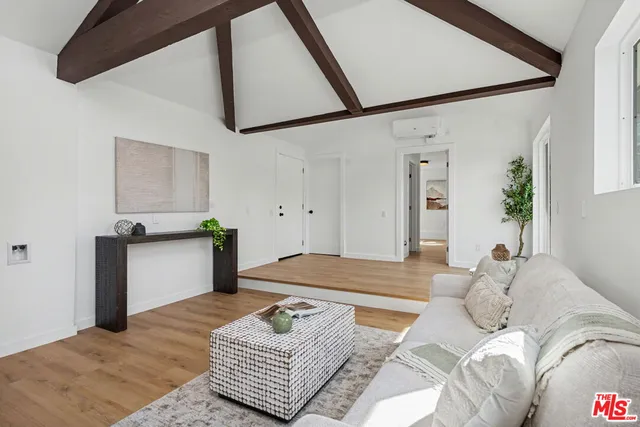a kitchen with stainless steel appliances and wooden cabinets
