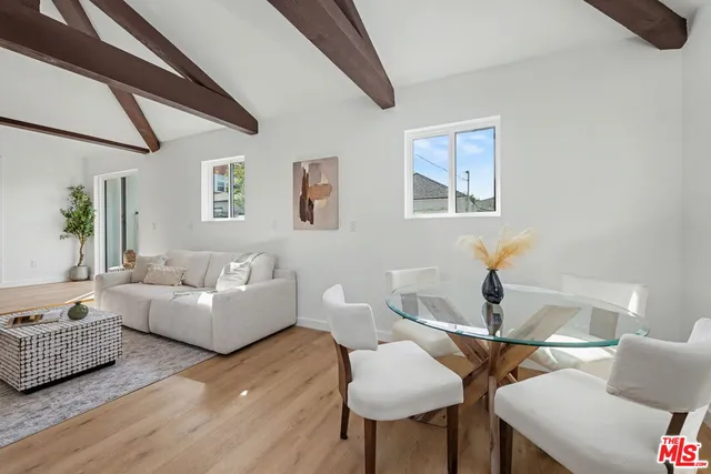 a kitchen with stainless steel appliances kitchen island granite countertop a sink and cabinets