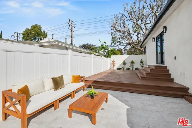 a view of a living room and kitchen