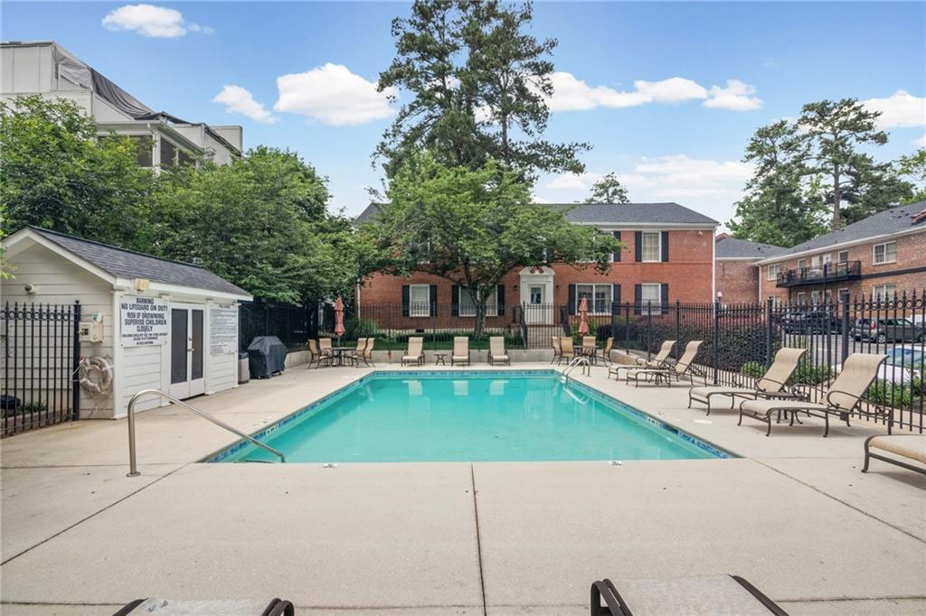 3675 Peachtree Road Northeast, Unit 45 Atlanta, GA 30319 - Photo 35 of 42 a view of a house with swimming pool and sitting area