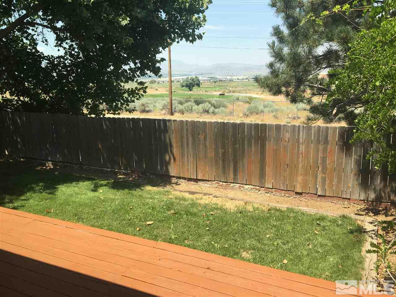 6655 Lotus Street Reno, NV 89506 - Photo 12 of 18 a view of a backyard with wooden fence