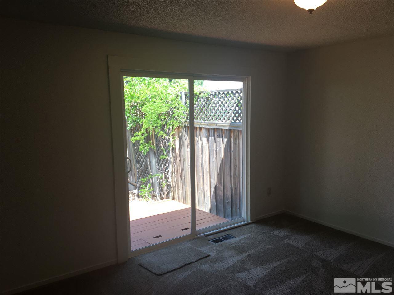 6655 Lotus Street Reno, NV 89506 - Photo 13 of 18 wooden floor and window in an empty room