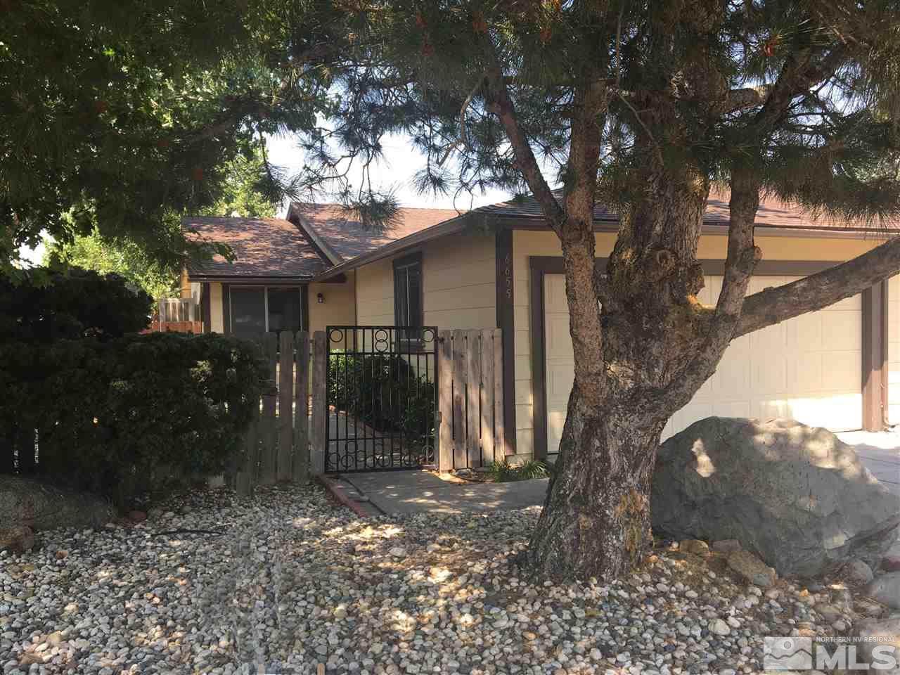 6655 Lotus Street Reno, NV 89506 - Photo 18 of 18 a view of a house with a tree