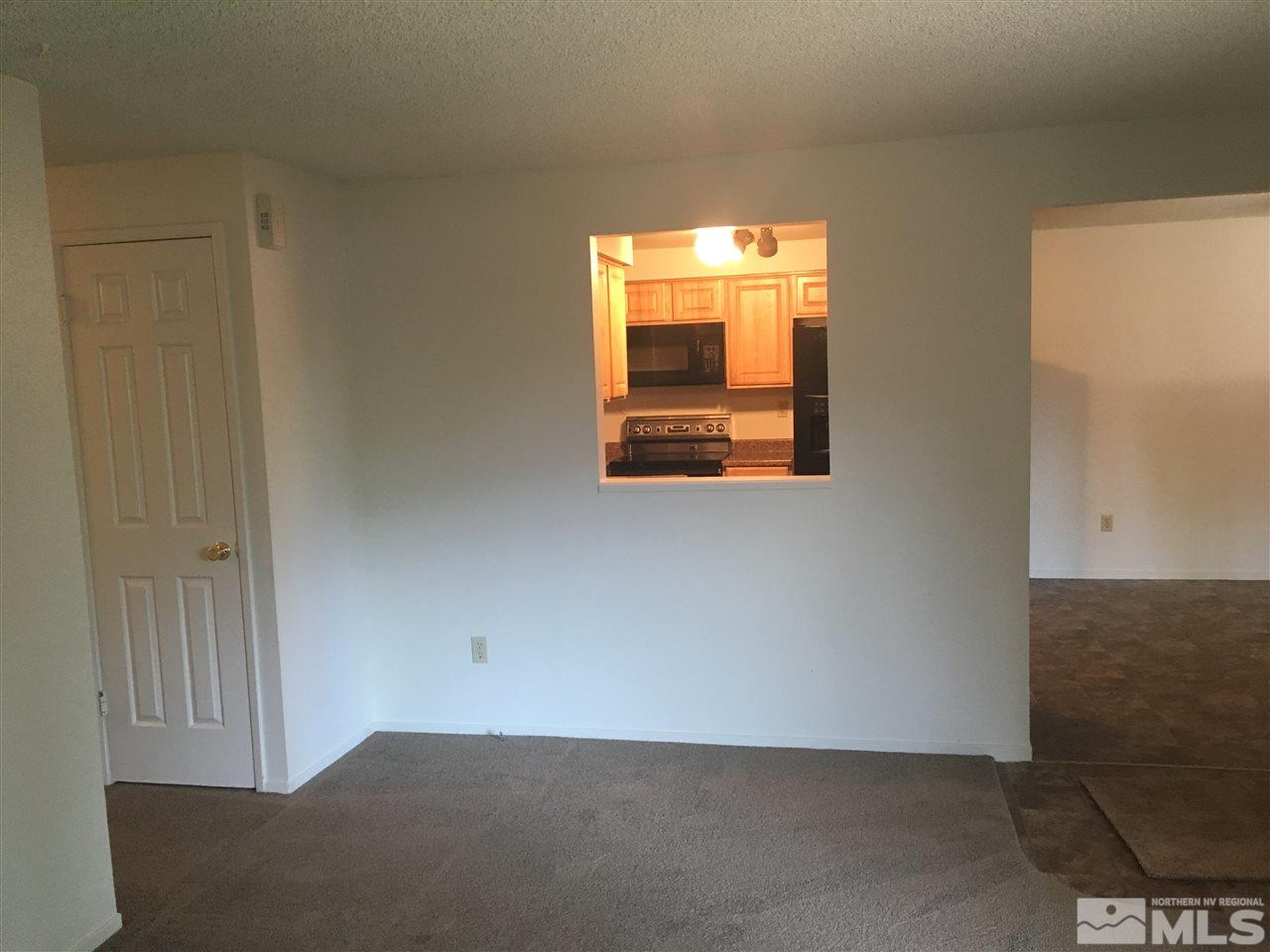 6655 Lotus Street Reno, NV 89506 - Photo 8 of 18 a view of an empty room and window