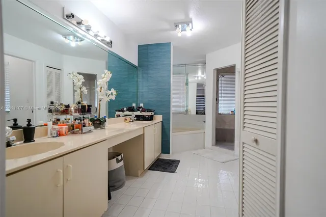 a kitchen with a sink cabinets and appliances