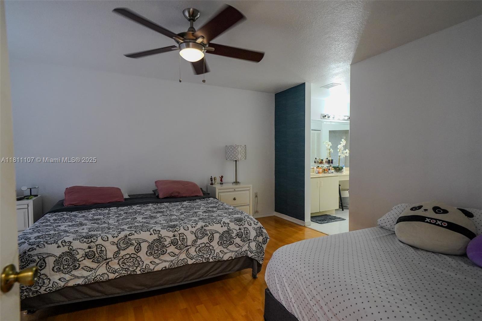 14816 Southwest 104th Street, Unit 85 Miami, FL 33196 - Photo 10 of 20 a bedroom with two beds and ceiling fan
