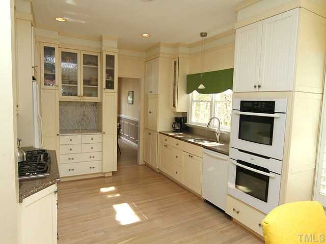 5101 Talton Circle Raleigh, NC 27612 - Photo 7 of 25 Gourmet chef's kitchen with double ovens, granite counter tops, marble nook, gas cooktop, under counter mount sink and can lights. Kitchen