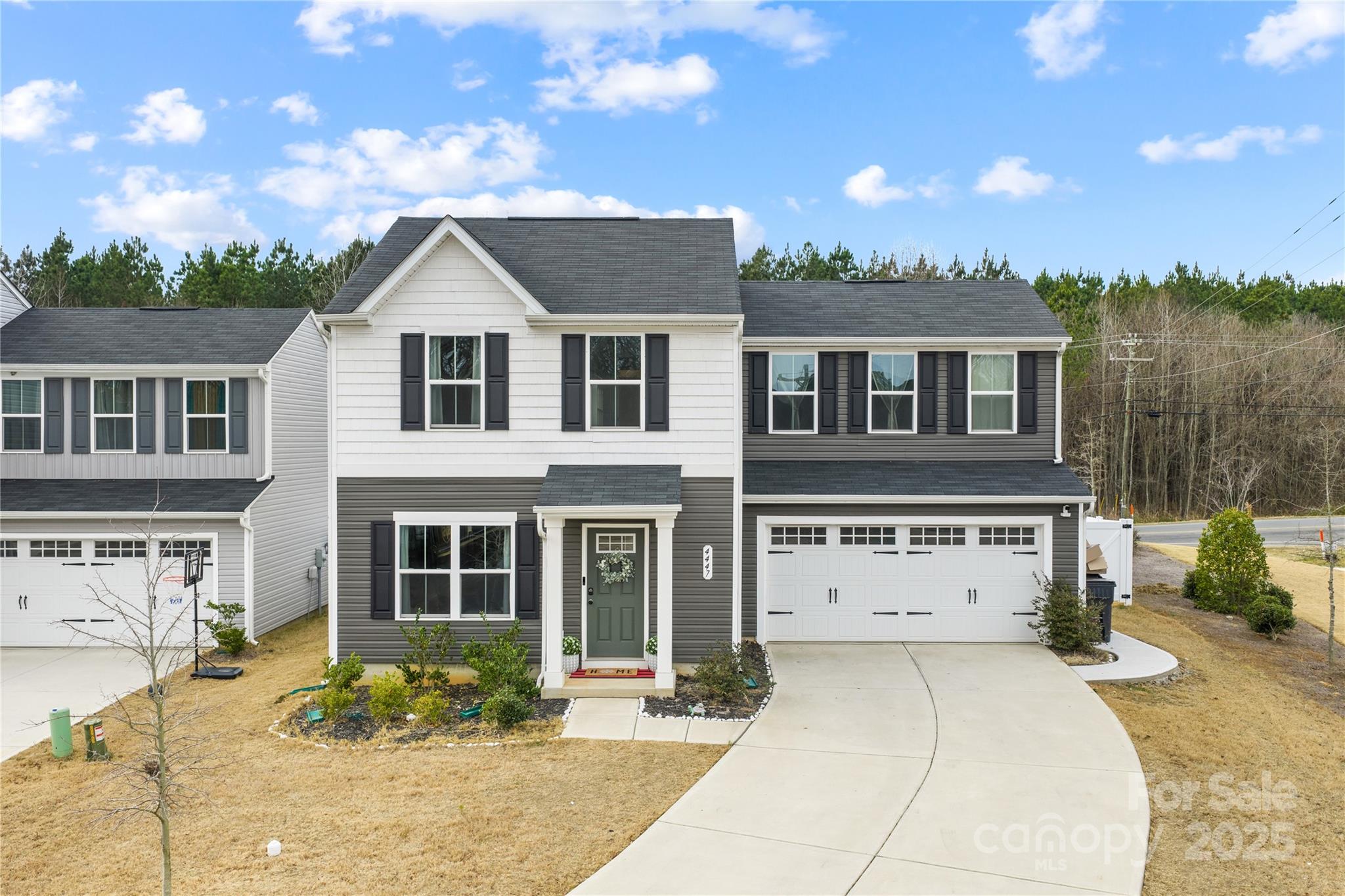 4447 Wild Rdg Drive Charlotte, NC 28215 - Photo 1 of 30 a front view of a house with a yard