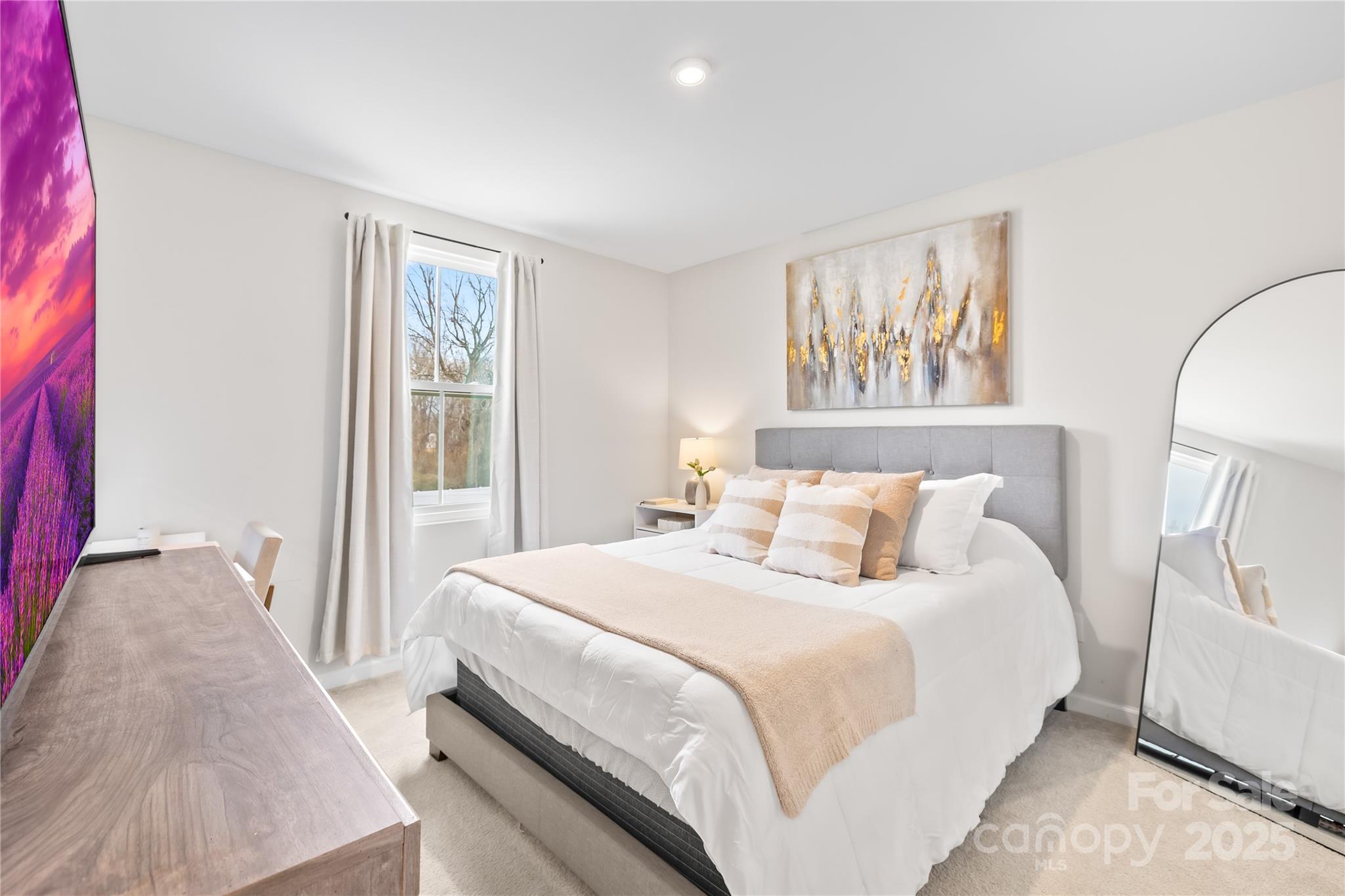 4447 Wild Rdg Drive Charlotte, NC 28215 - Photo 16 of 30 a bedroom with a bed and a large mirror