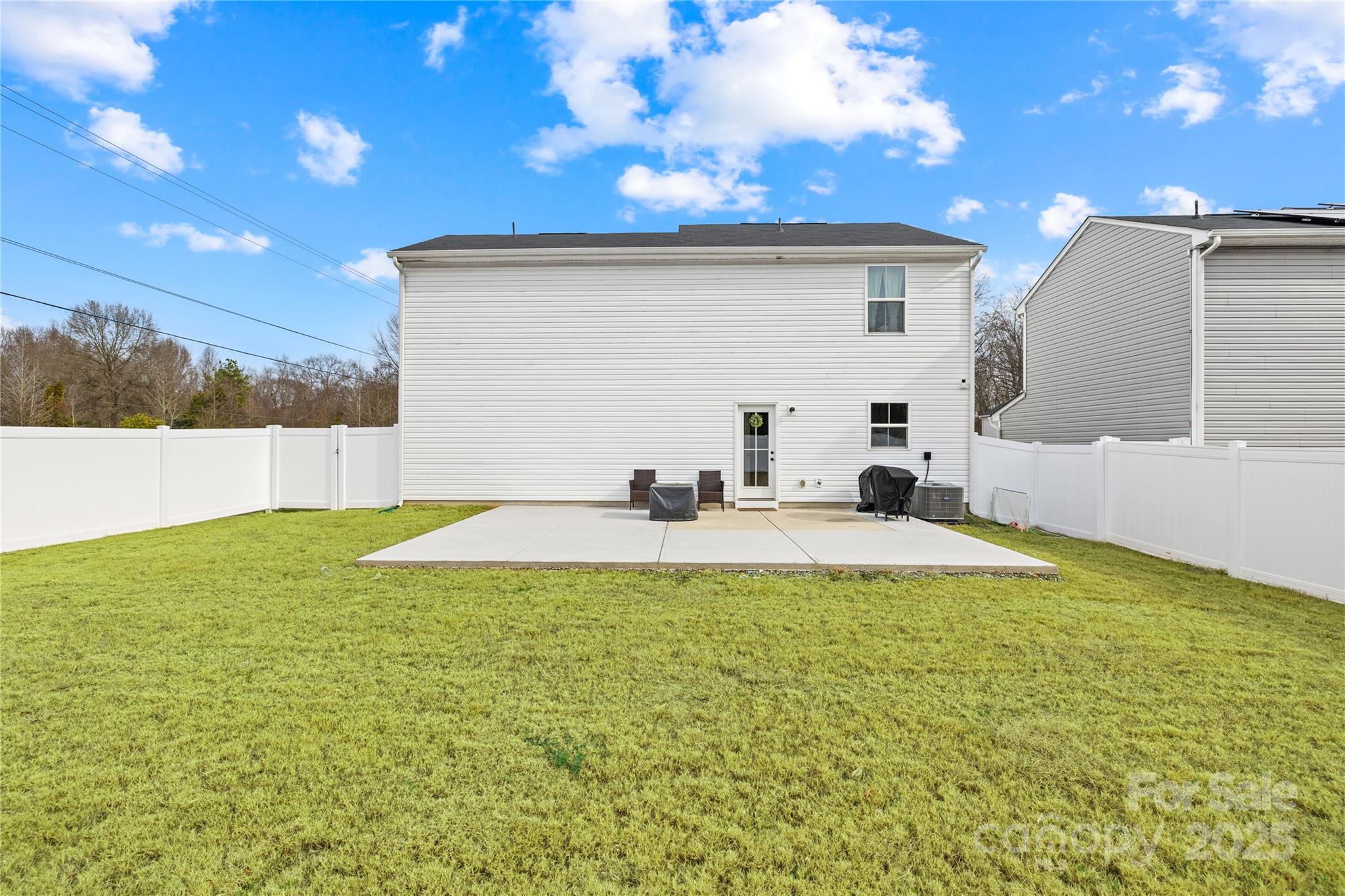 4447 Wild Rdg Drive Charlotte, NC 28215 - Photo 23 of 30 a view of pool with seating area and green space