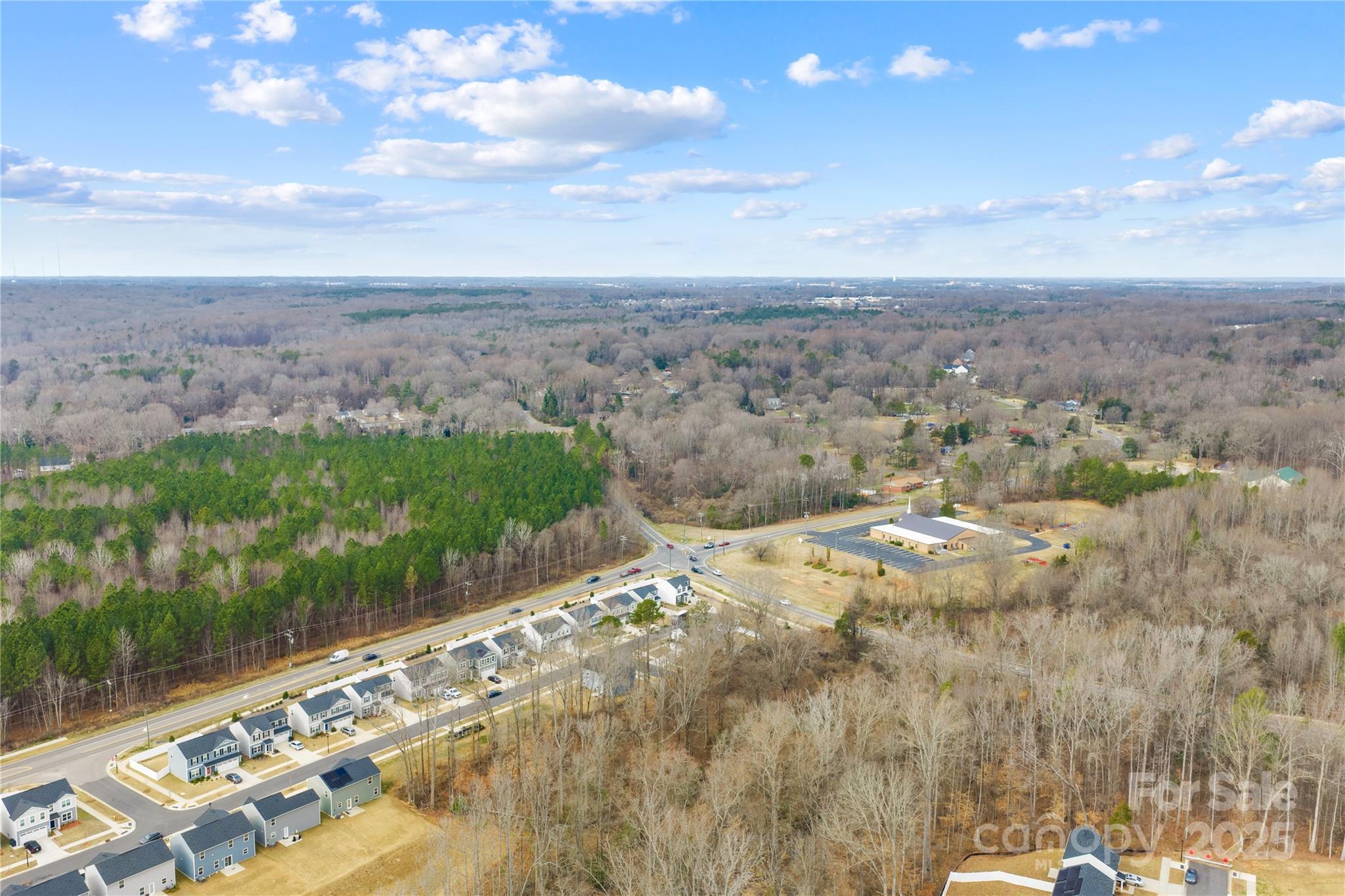4447 Wild Rdg Drive Charlotte, NC 28215 - Photo 28 of 30 a view of a lake with a city