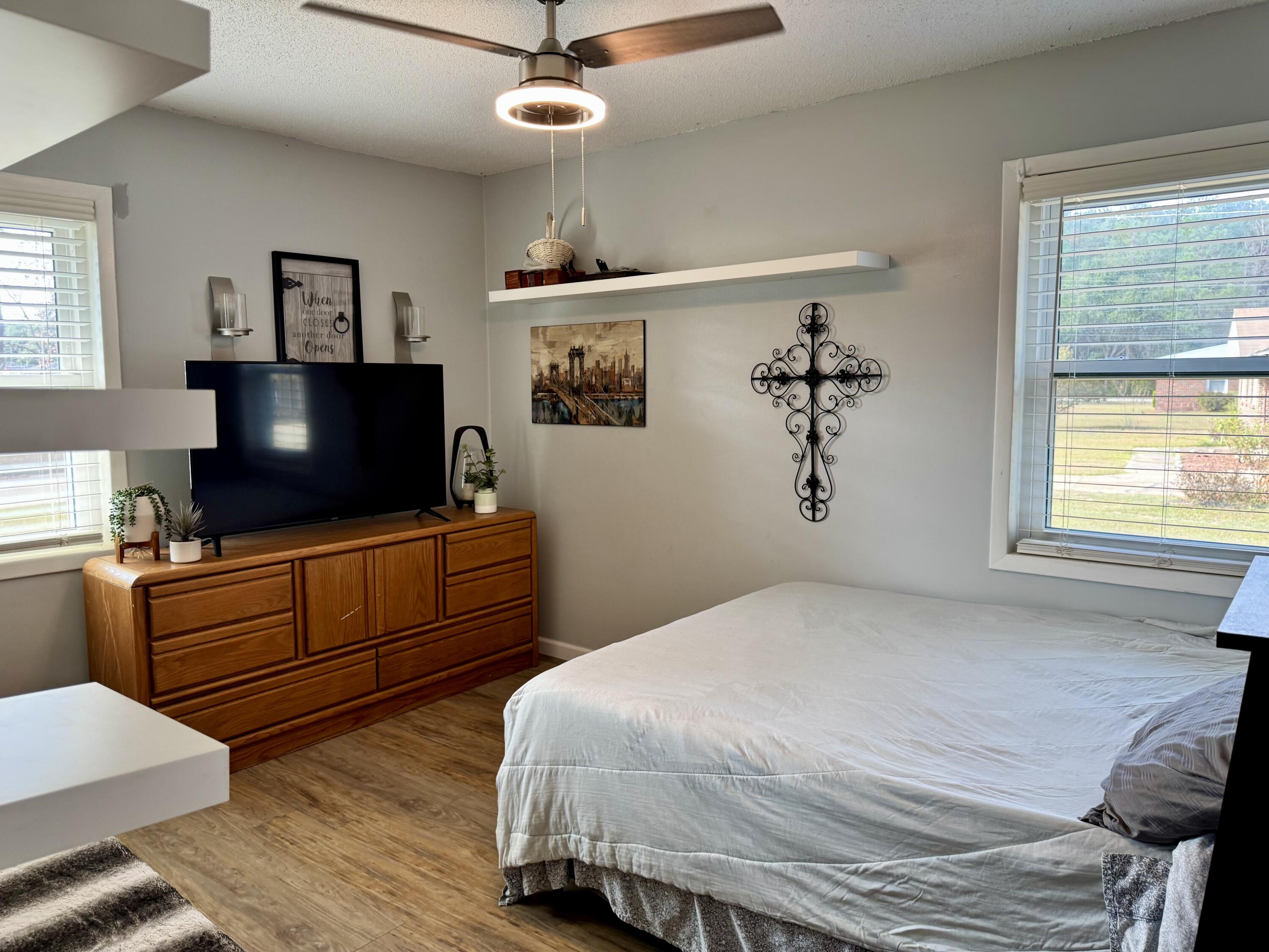 1133 Oak Avenue Elba, AL 36323 - Photo 13 of 26 a bedroom with a bed and a flat screen tv