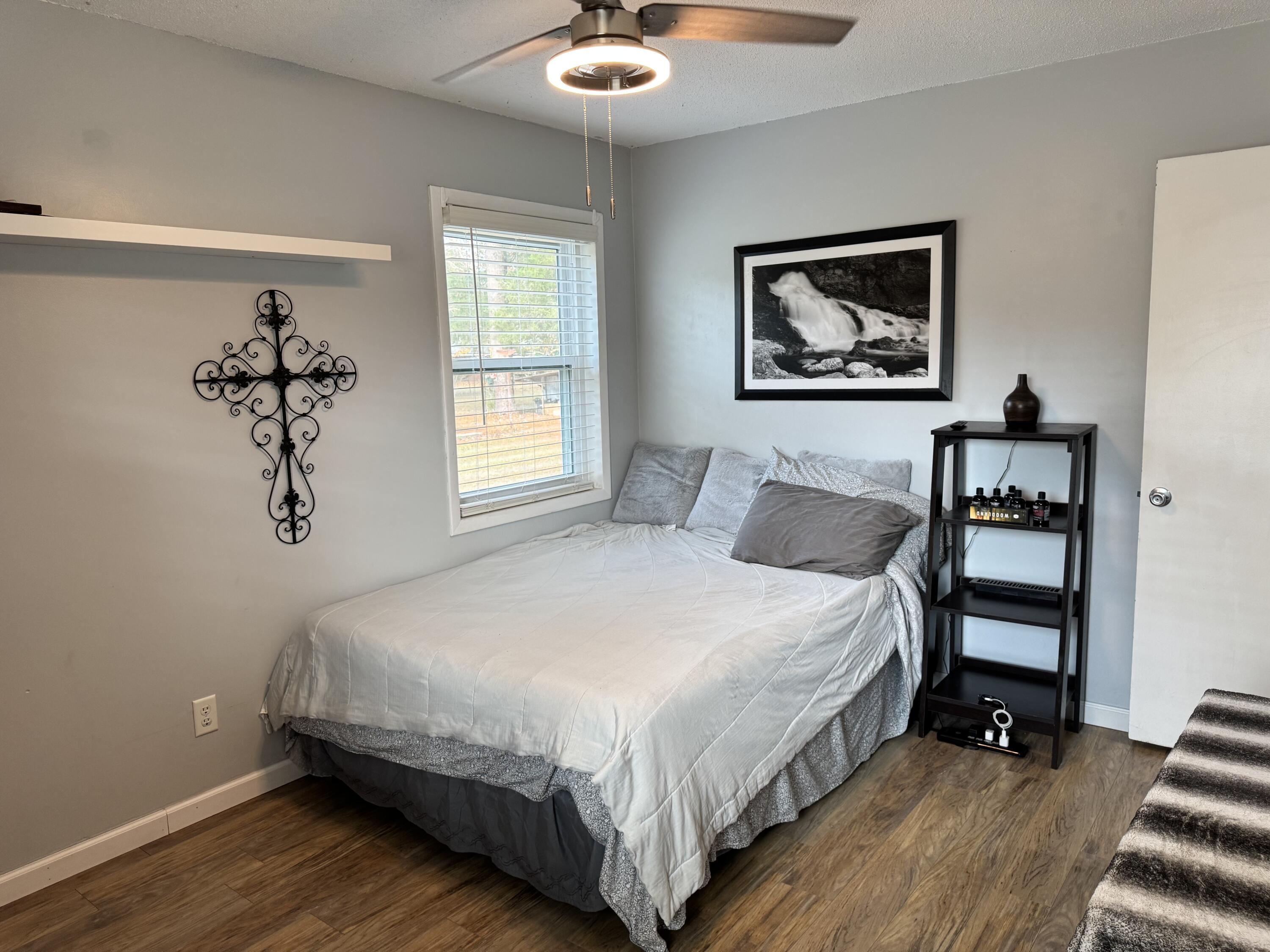 1133 Oak Avenue Elba, AL 36323 - Photo 14 of 26 a bedroom with a bed and a window