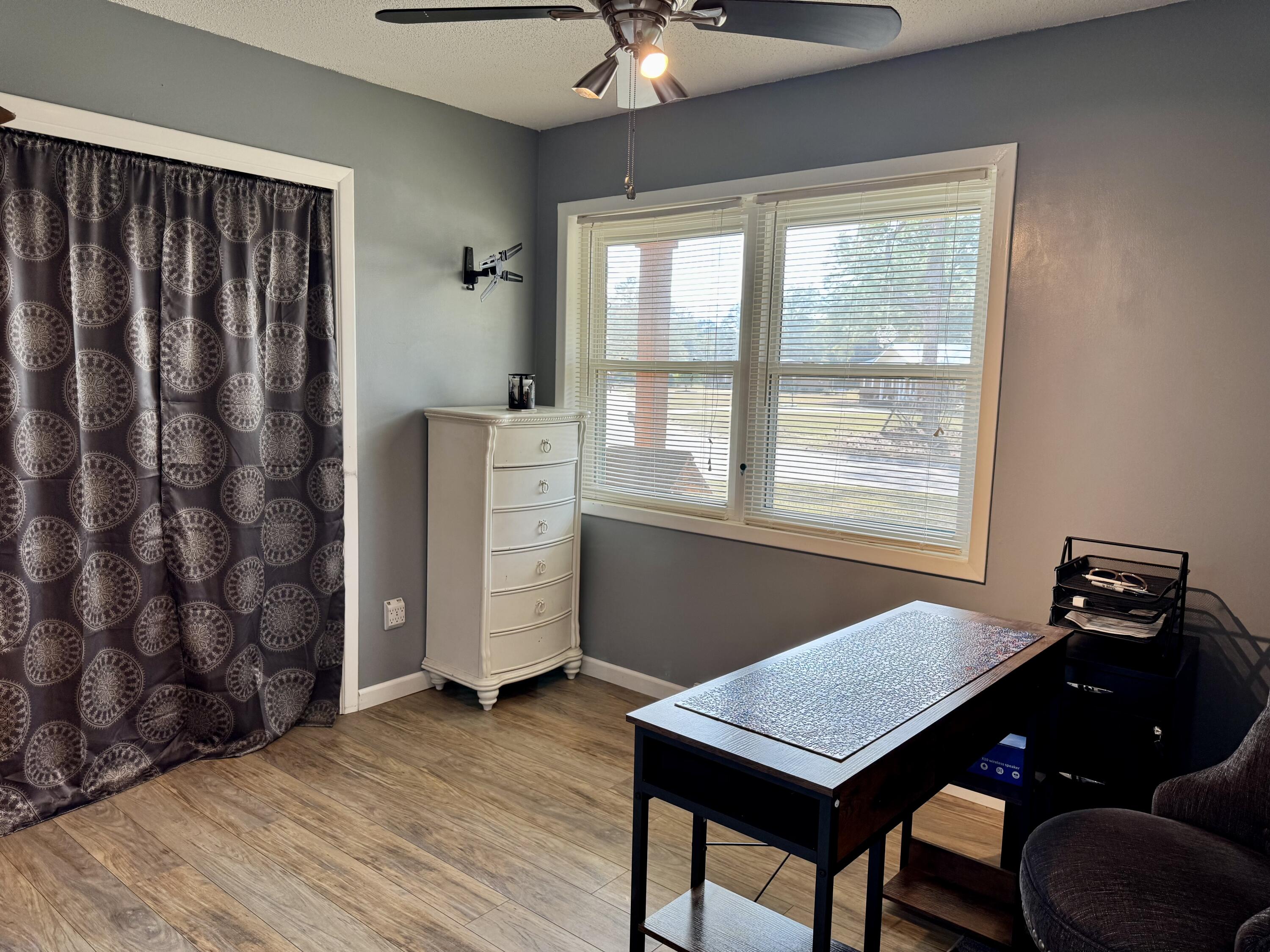 1133 Oak Avenue Elba, AL 36323 - Photo 15 of 26 a view of a workspace with furniture and a window