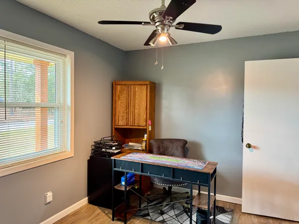 a workspace with furniture and window