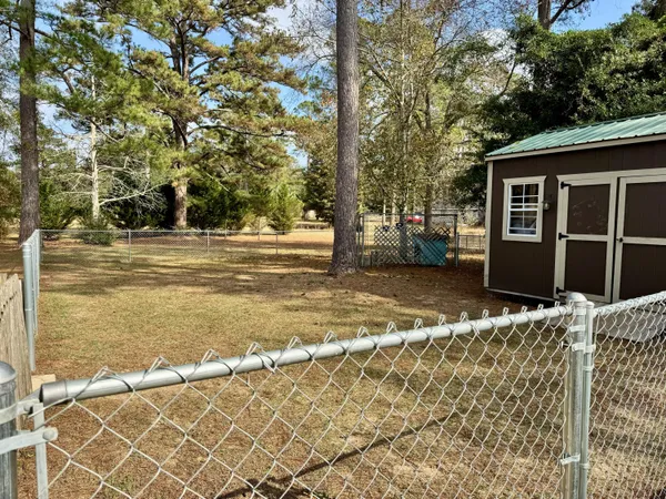 a view of a house with a yard and garage