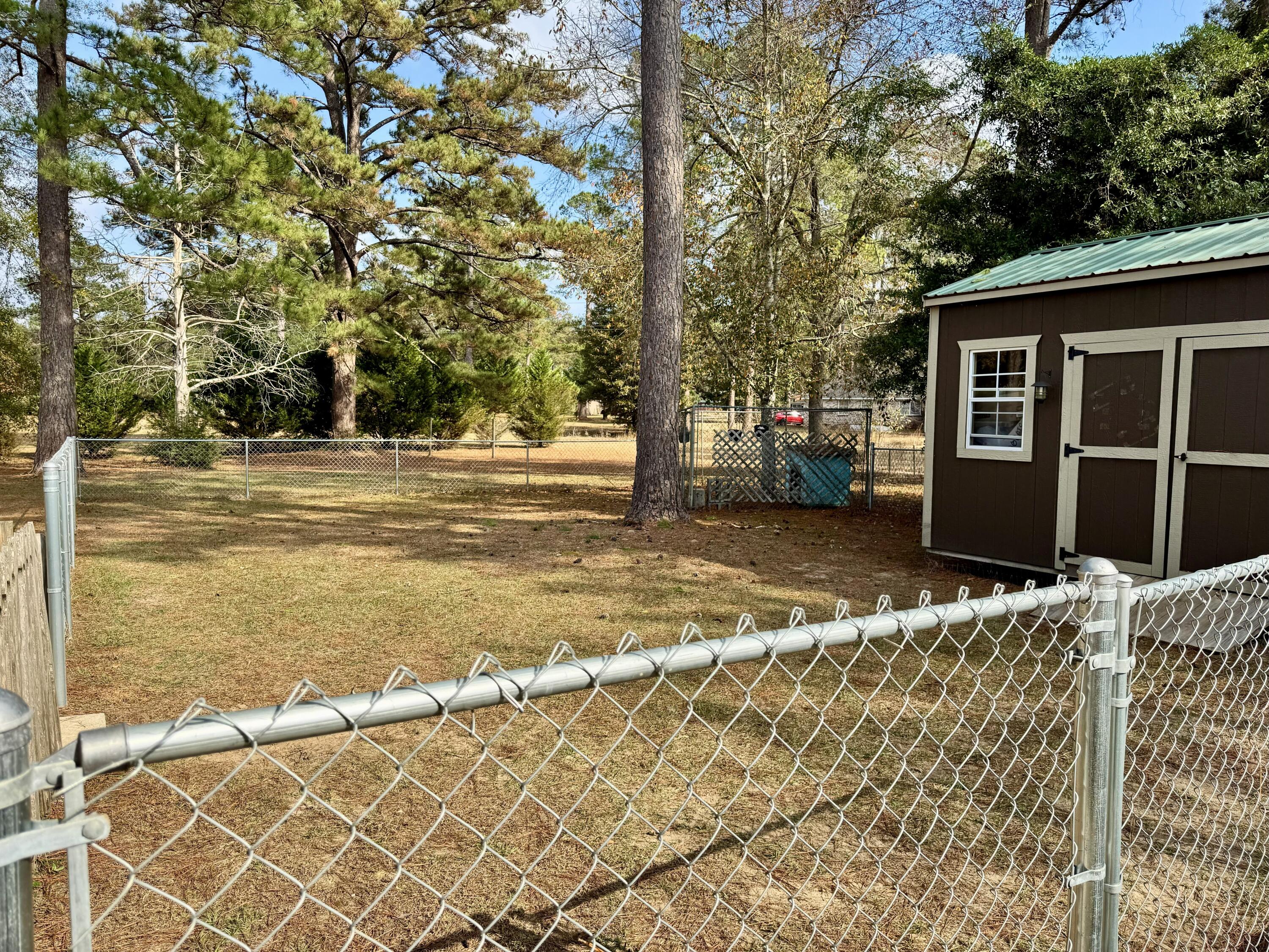 1133 Oak Avenue Elba, AL 36323 - Photo 17 of 26 a view of a house with a yard and garage
