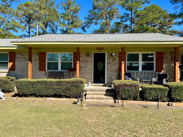 front view of a house with a outdoor seating