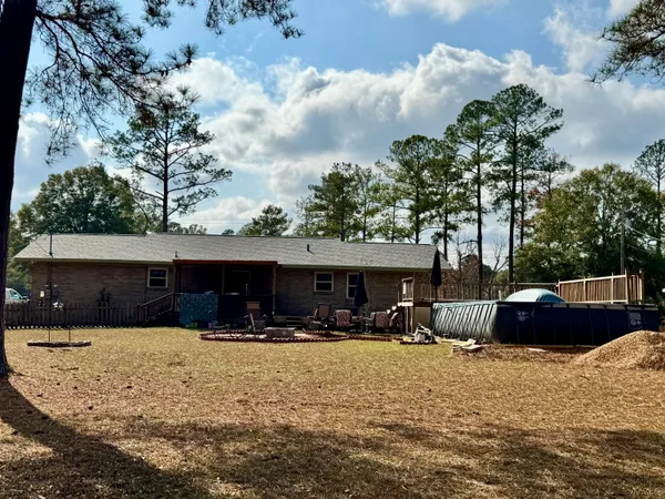 a deck with a table and chairs