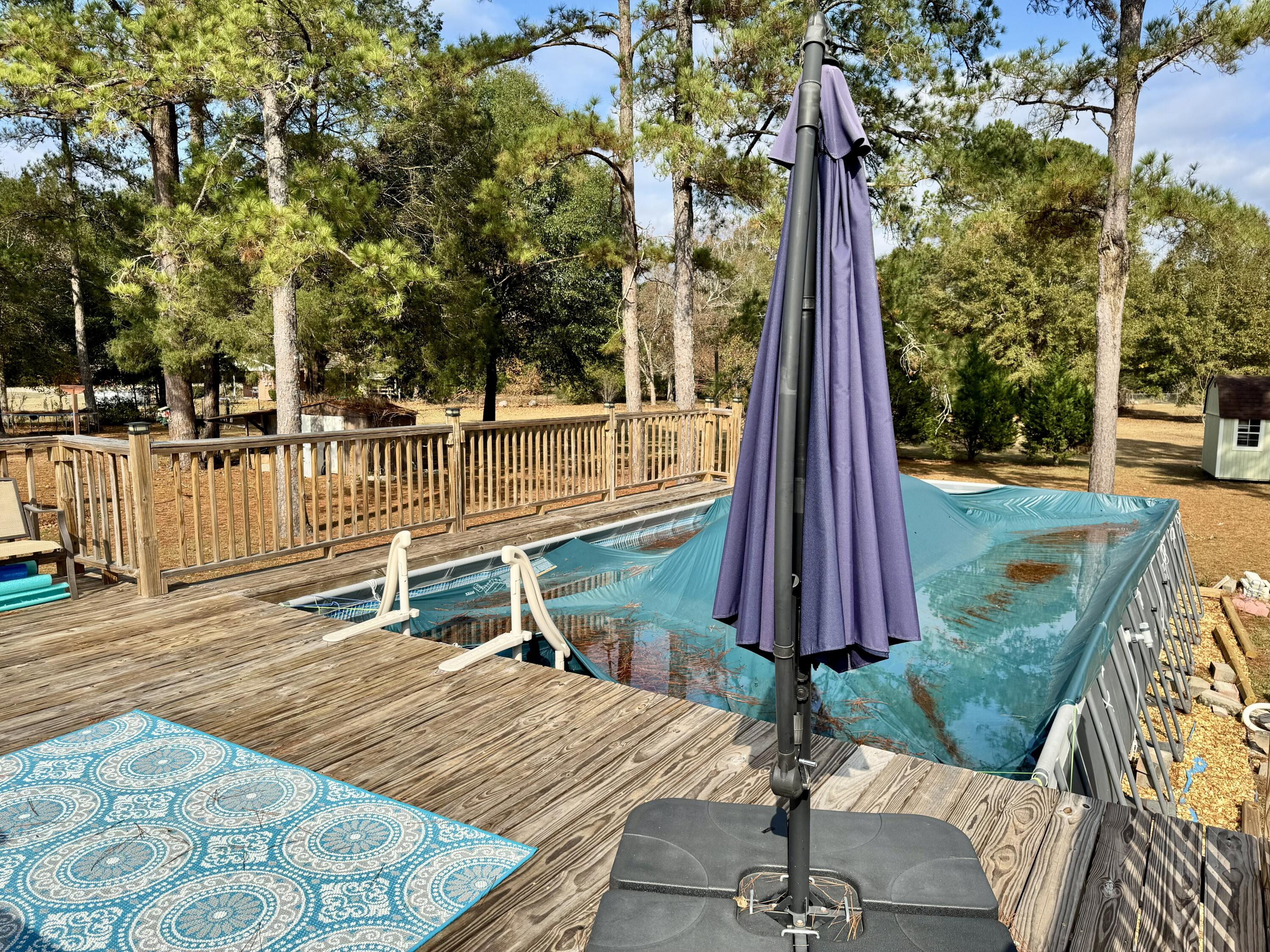 1133 Oak Avenue Elba, AL 36323 - Photo 25 of 26 a deck with a table and chairs