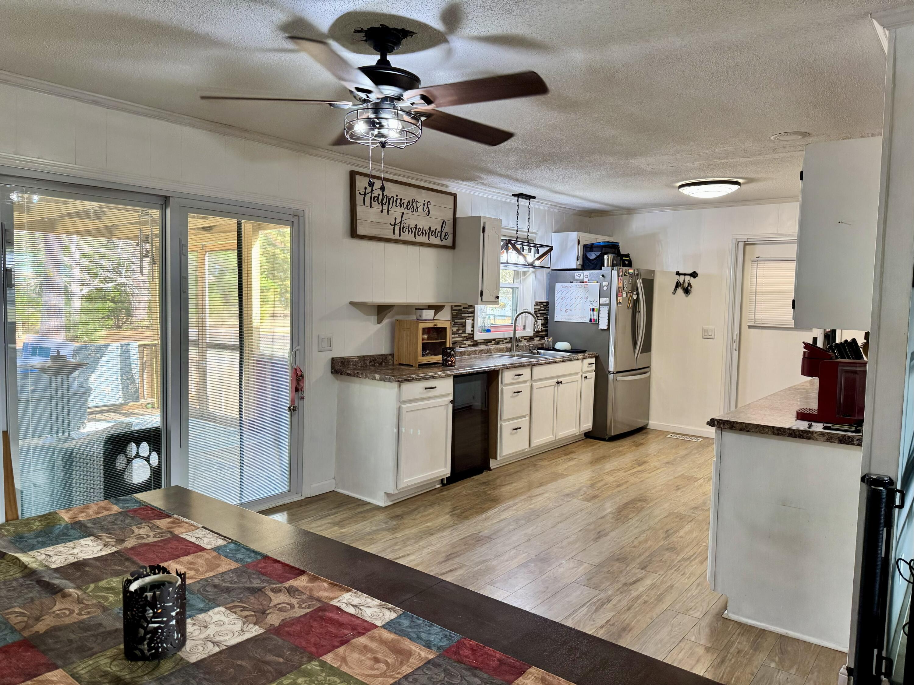 1133 Oak Avenue Elba, AL 36323 - Photo 8 of 26 a kitchen with stainless steel appliances granite countertop a sink stove and refrigerator