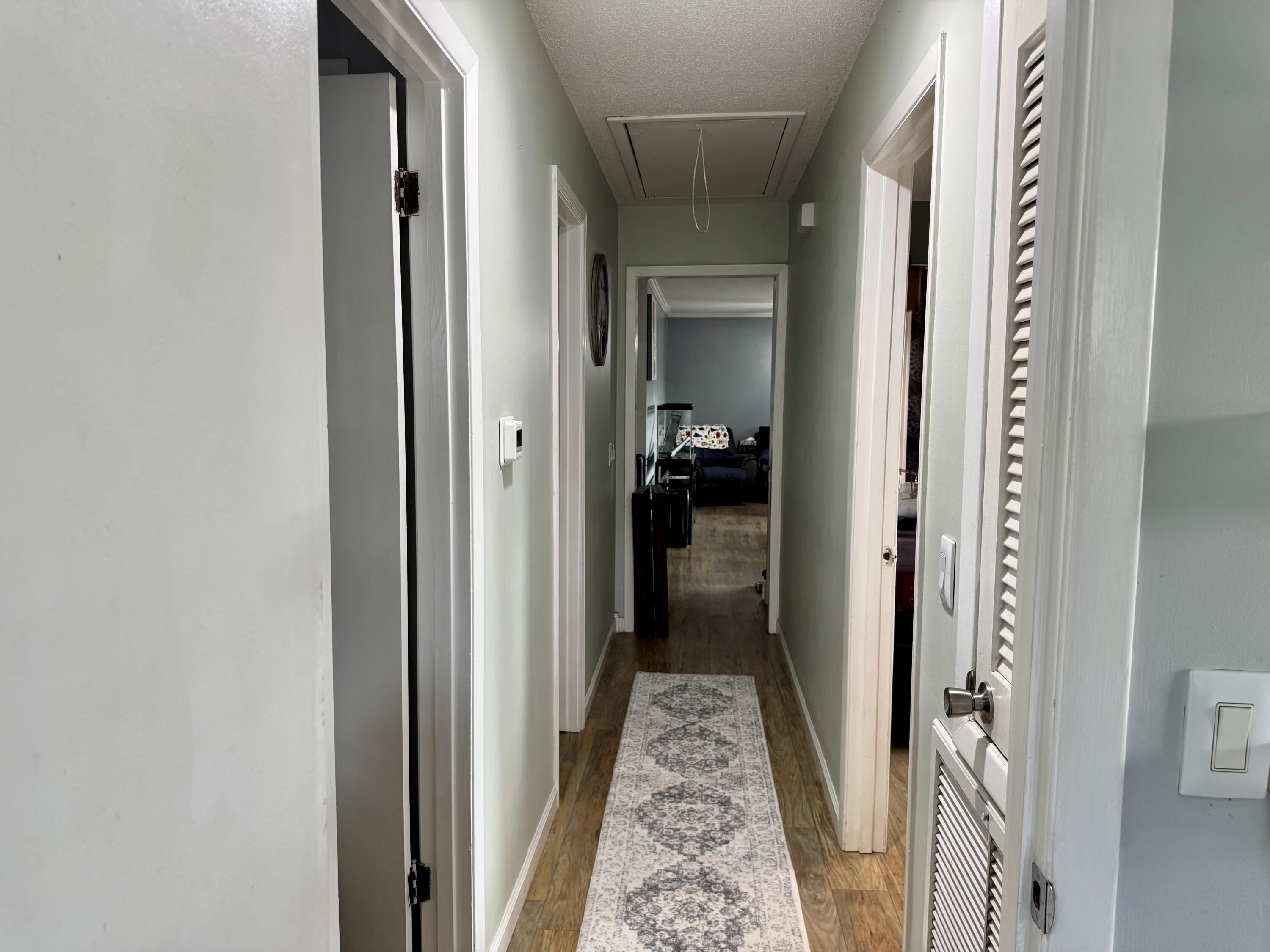 1133 Oak Avenue Elba, AL 36323 - Photo 9 of 26 a view of a hallway with a wooden door