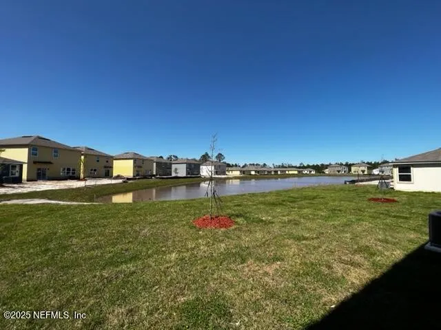 a view of a lake from a yard