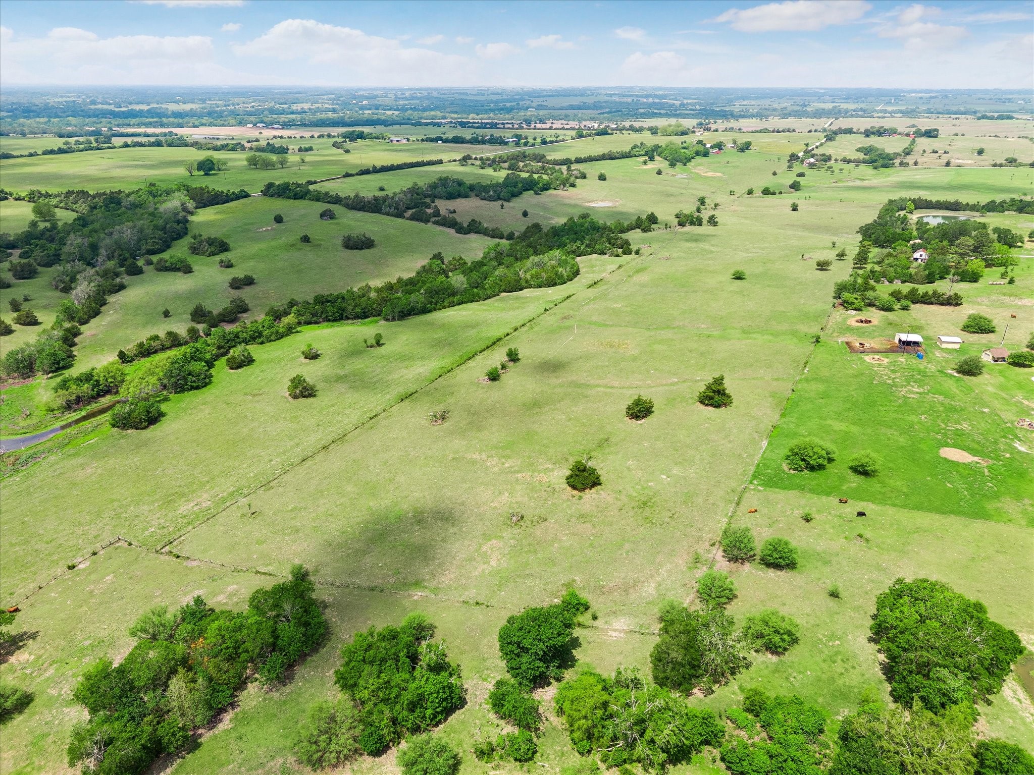 a view of a big yard with lots of green space and mountain view