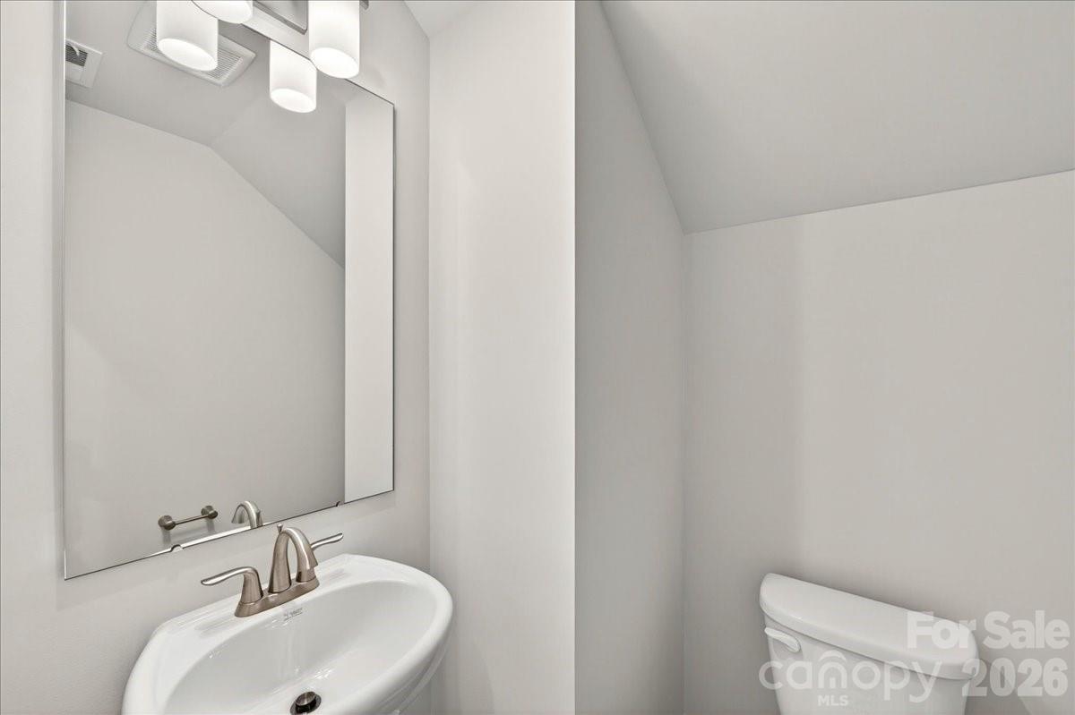 512 Webster Lane Cramerton, NC 28032 - Photo 14 of 28 a bathroom with a sink and a mirror