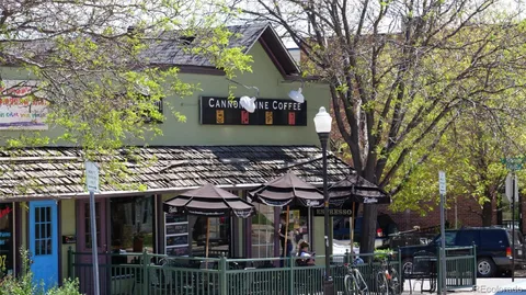 a front view of a building with parking space