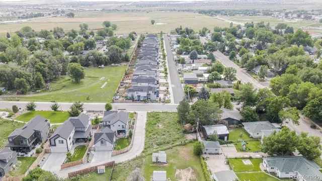 a view of a balcony with yard