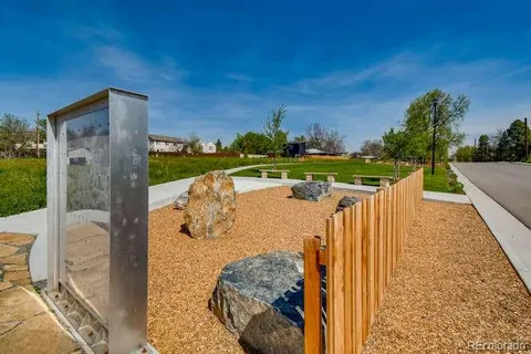 a view of a garden with an outdoor seating