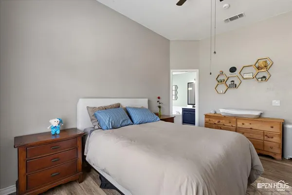 a bedroom with a bed and a dresser