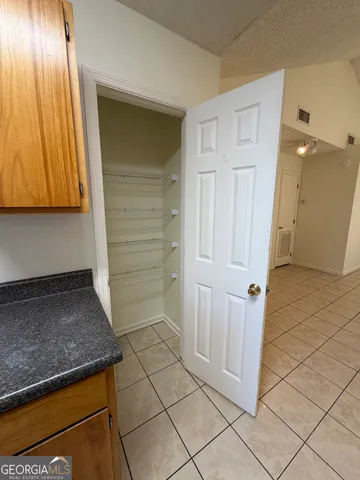 a view of a storage and utility room in a hall