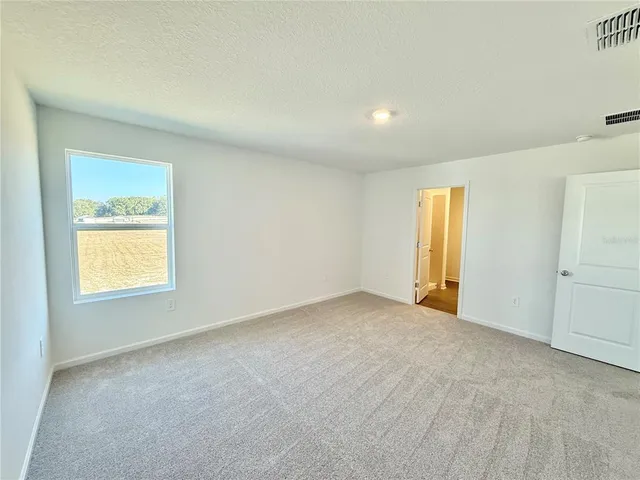 an empty room with a bathroom