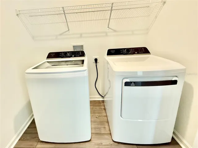 a bathroom with a toilet a sink and a mirror