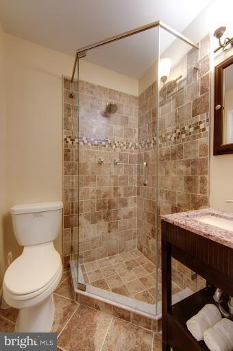 4748 Byron Road Windsor Mill, MD 21244 - Photo 12 of 27 a bathroom with a shower and a toilet
