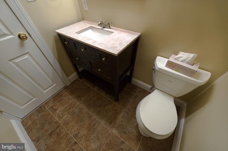 4748 Byron Road Windsor Mill, MD 21244 - Photo 13 of 27 a bathroom with a sink toilet and mirror