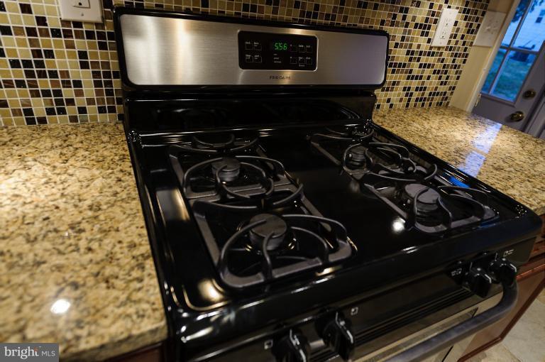 4748 Byron Road Windsor Mill, MD 21244 - Photo 20 of 27 a close up of a stove top oven sitting inside of a kitchen