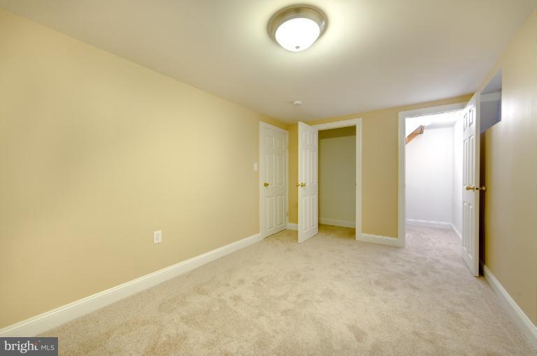 4748 Byron Road Windsor Mill, MD 21244 - Photo 3 of 27 an empty room with a natural light