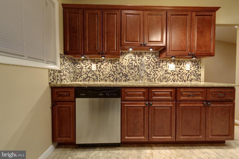 4748 Byron Road Windsor Mill, MD 21244 - Photo 23 of 27 a view of a kitchen with granite countertop wooden cabinets