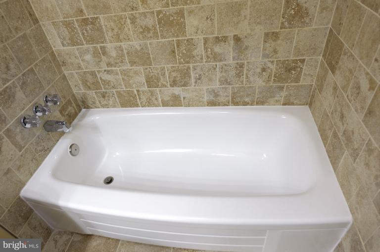 4748 Byron Road Windsor Mill, MD 21244 - Photo 9 of 27 a bathroom with a bathtub
