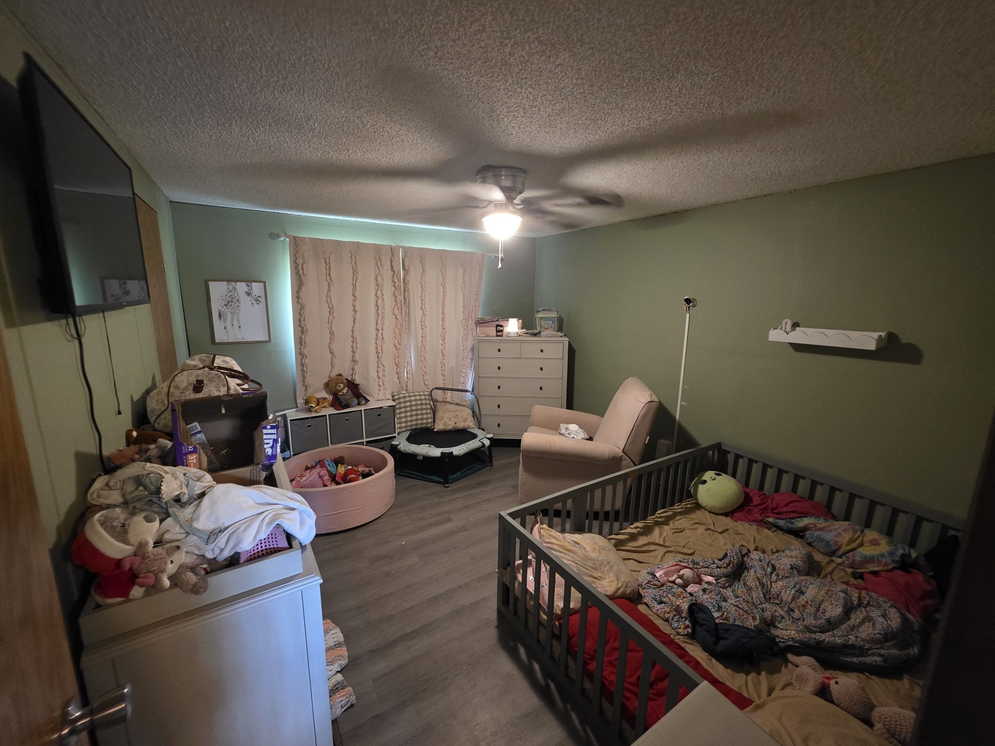 225 Opossum Hollow Road Watertown, TN 37184 - Photo 20 of 29 a living room with furniture and a flat screen tv