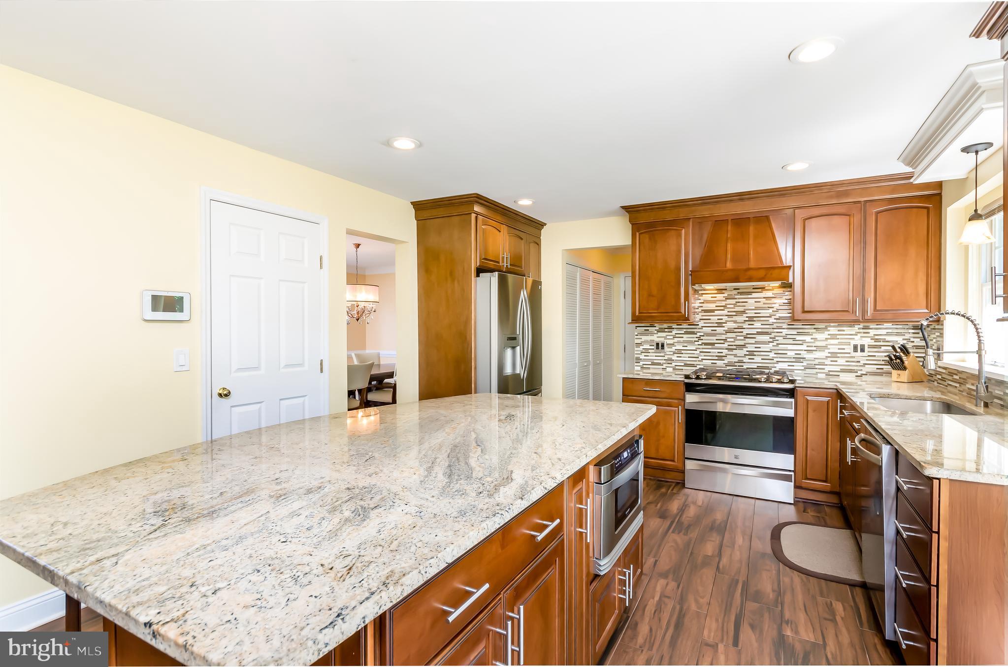 7203 Kyle's Landing Springfield, VA 22150 - Photo 3 of 48 Merillat solid wood cabinets and granite counters