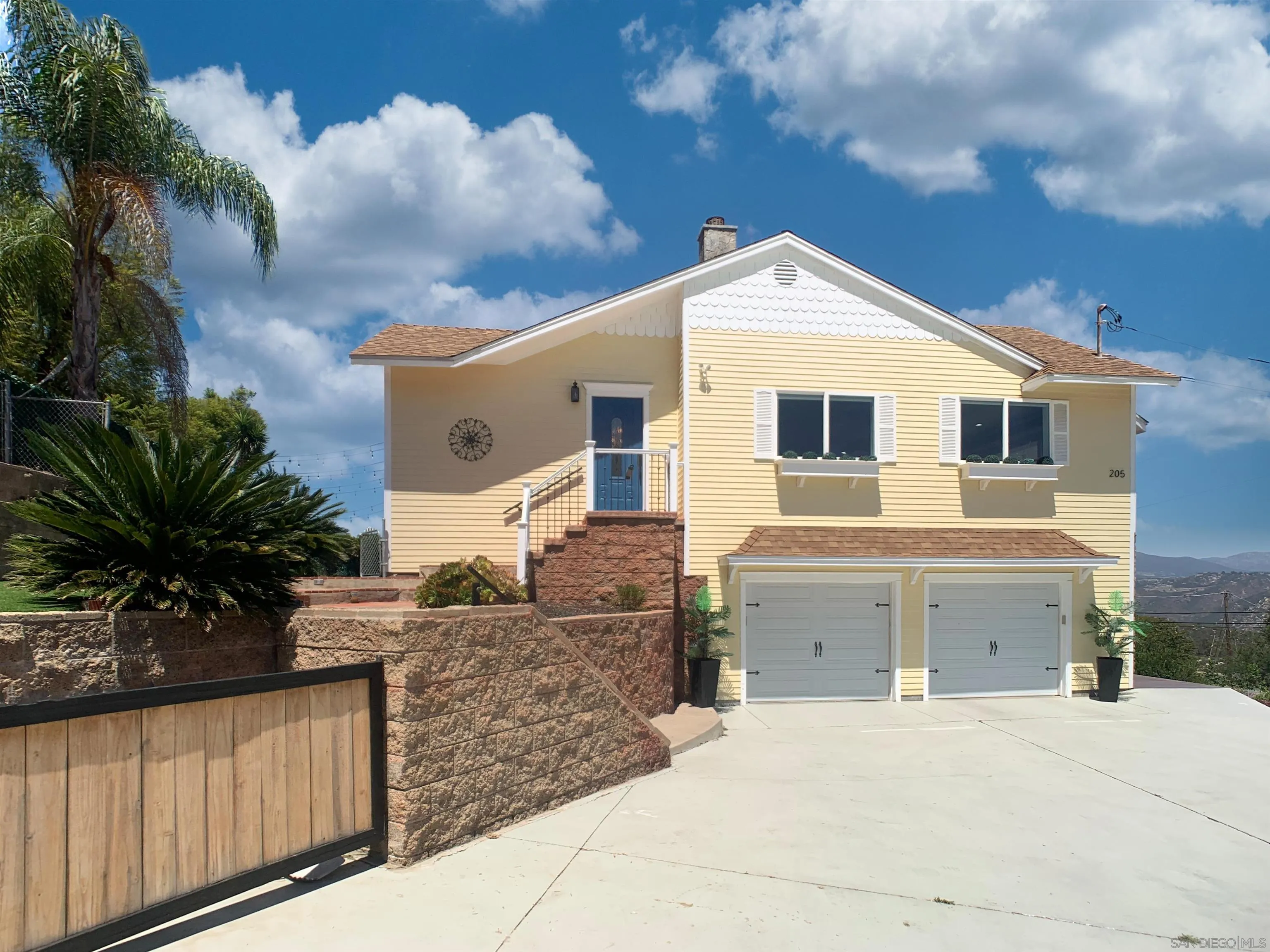 205 Highline Trail El Cajon, CA 92021 - Photo 5 of 45 a front view of a house with a yard