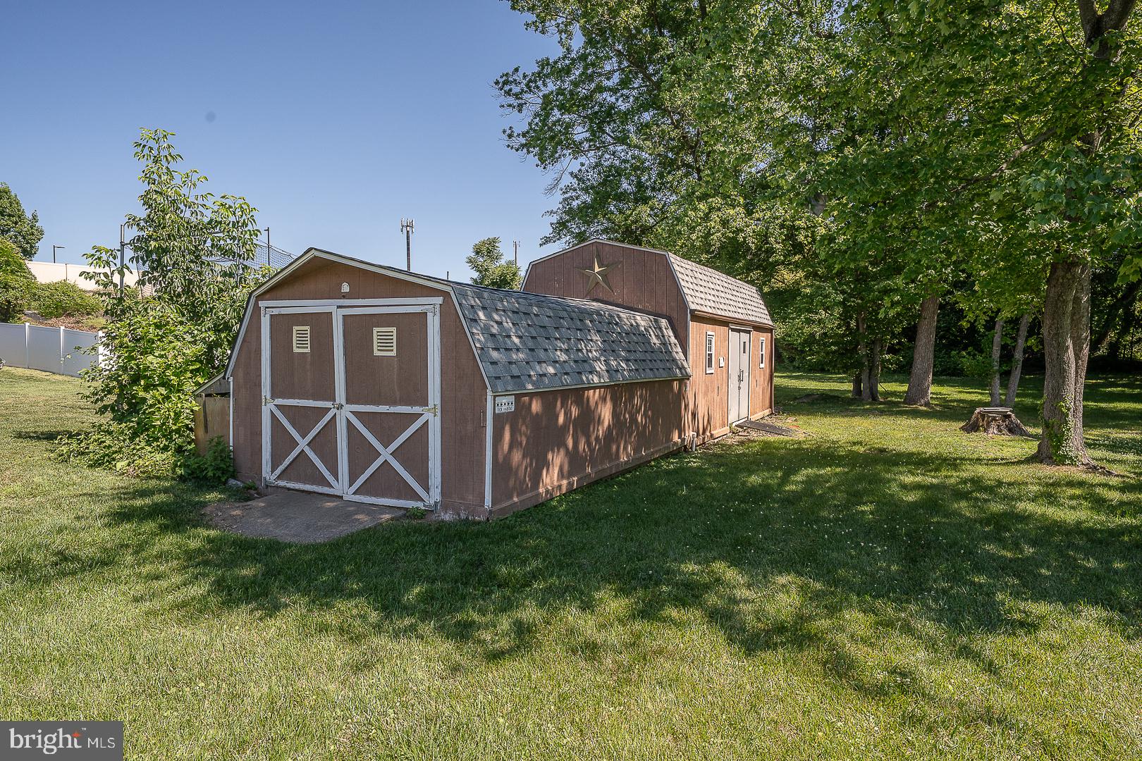 437 Rittenhouse Circle Havertown, PA 19083 - Photo 46 of 55 Charming shed nestled in lush greenery.