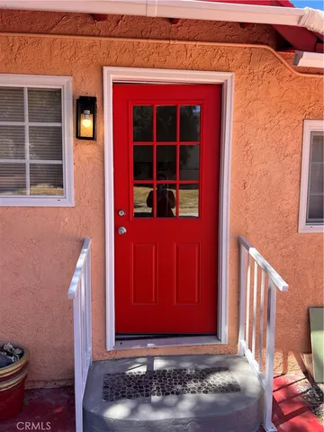 a view of a swimming pool with a house