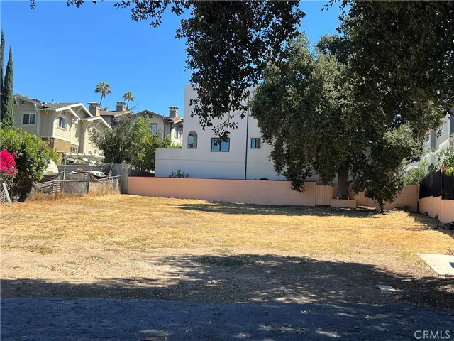 a view of a house with a small yard