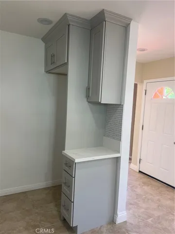 a utility room with cabinets