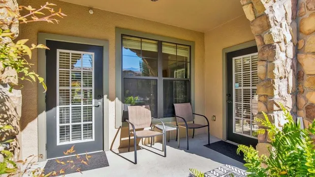 a view of a chair and table in the balcony